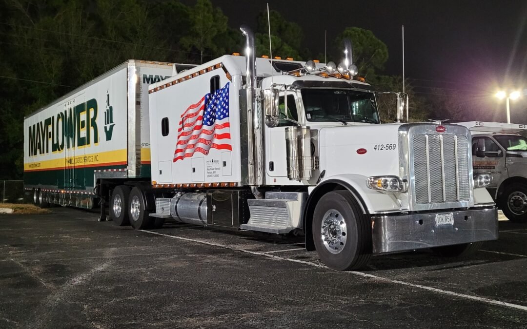 "Truck parked at a logistics center representing reliable trucking insurance services from a local insurance company near me."